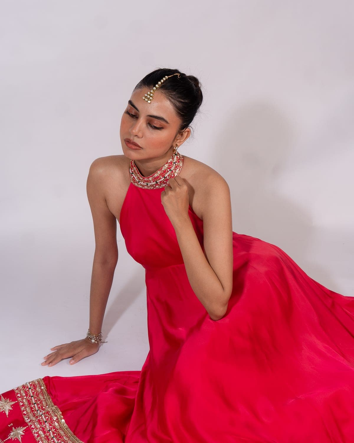 Leela campaign — the Raisa anarkali in pink, seated