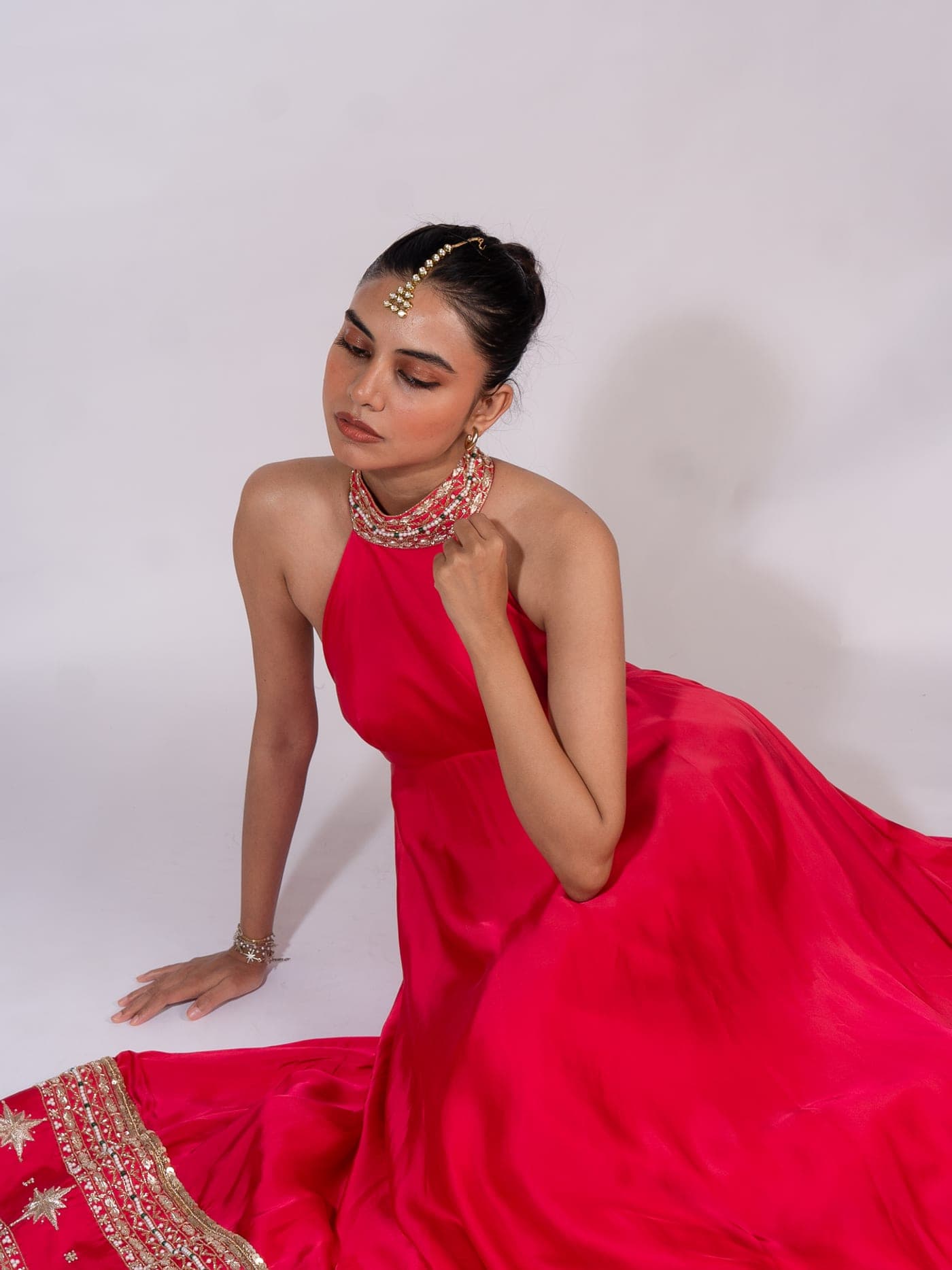 Leela campaign — the Raisa anarkali in pink, seated