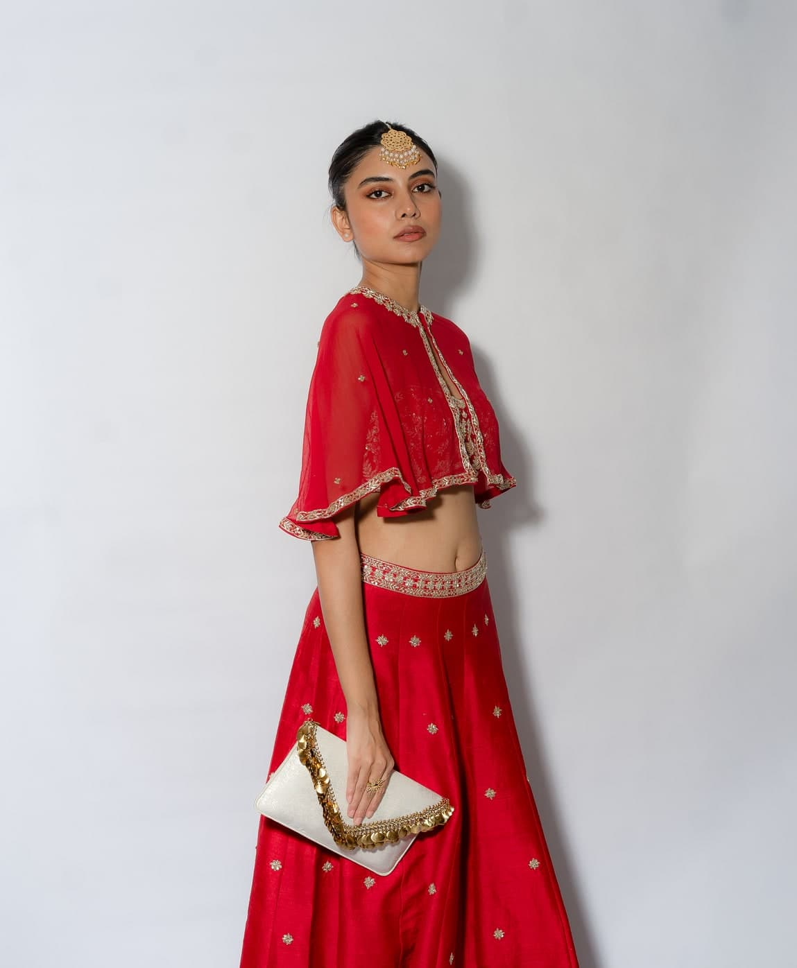 Arya kali lehenga in red raw silk, front view with the short embroidered cape